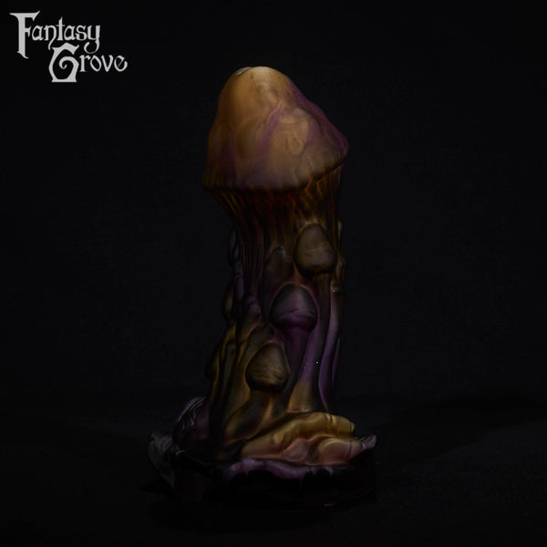 A fantasy sex toy on a black background with the Fantasy Grove logo in the upper left corner