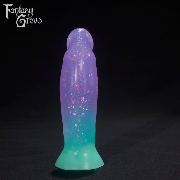 A Fantasy Grove sex toy on a black background with a logo in the upper left corner