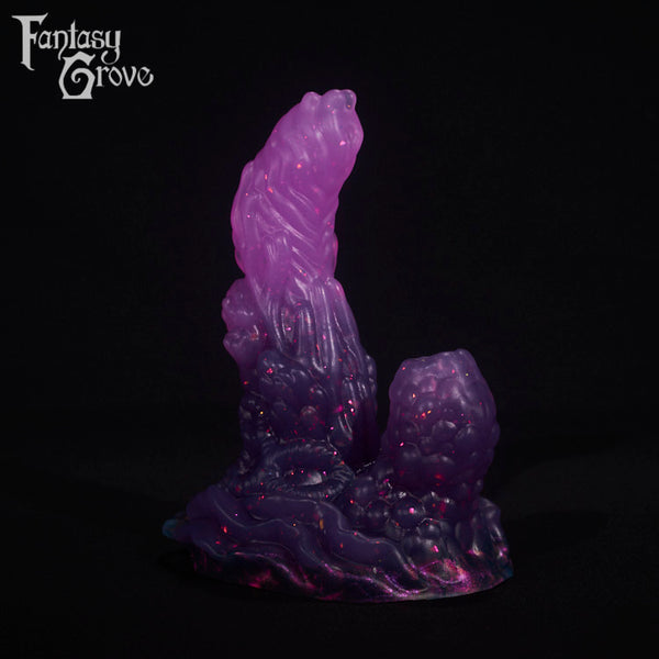 A fantasy sex toy on a black background with the Fantasy Grove logo in the upper left corner