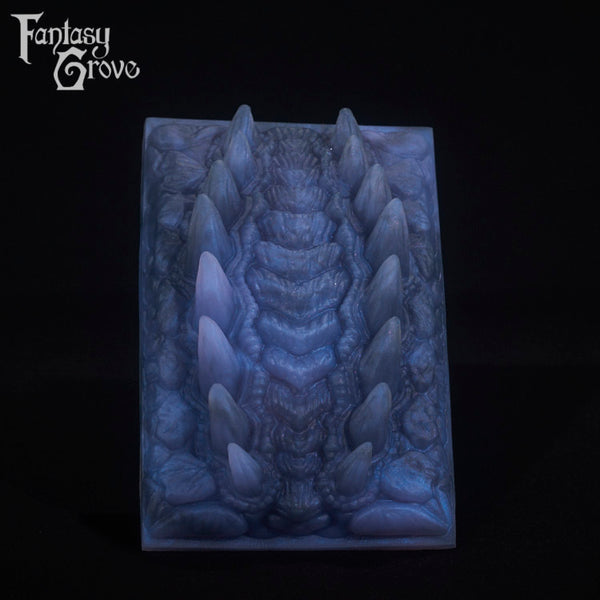 A fantasy sex toy on a black background with the Fantasy Grove logo in the upper left corner