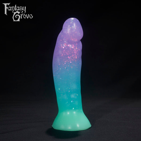 A Fantasy Grove sex toy on a black background with a logo in the upper left corner