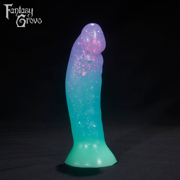 A Fantasy Grove sex toy on a black background with a logo in the upper left corner