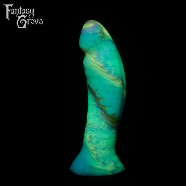 A fantasy sex toy on a black background with the Fantasy Grove logo in the upper left corner