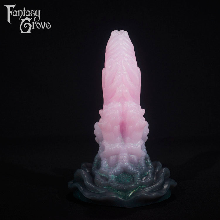 A fantasy sex toy on a black background with the Fantasy Grove logo in the upper left corner