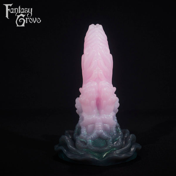 A fantasy sex toy on a black background with the Fantasy Grove logo in the upper left corner