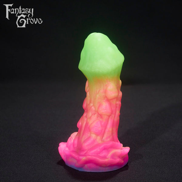 A fantasy sex toy on a black background with the Fantasy Grove logo in the upper left corner 