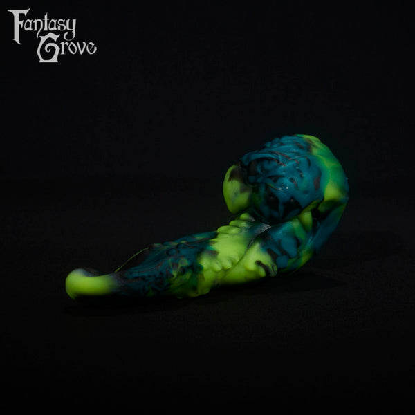 A fantasy sex toy on a black background with the Fantasy Grove logo in the upper left corner