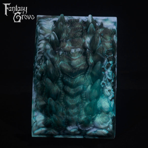 A fantasy sex toy on a black background with the Fantasy Grove logo in the upper left corner