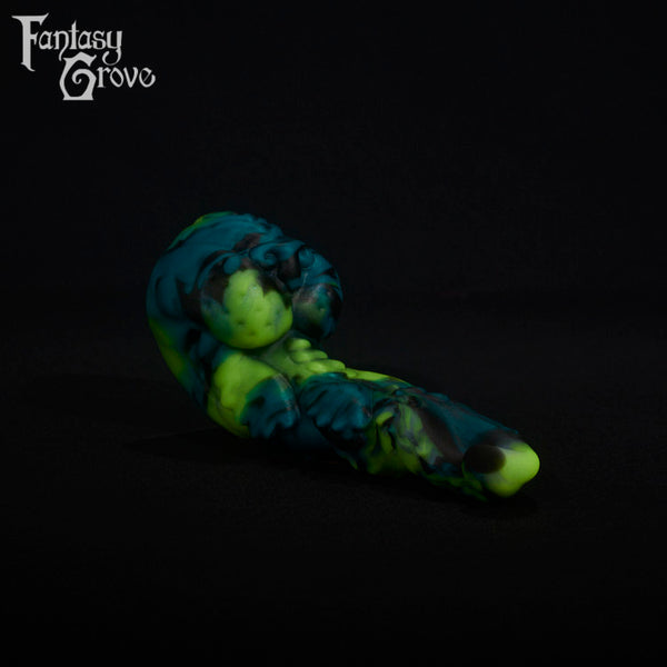 A fantasy sex toy on a black background with the Fantasy Grove logo in the upper left corner