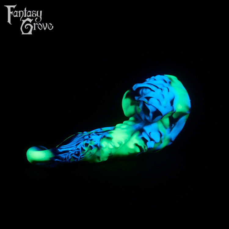 A fantasy sex toy on a black background with the Fantasy Grove logo in the upper left corner