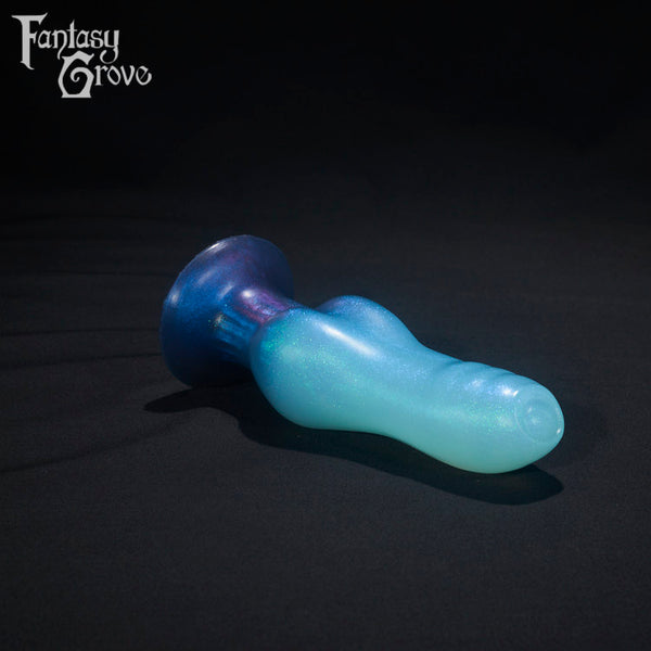 A Fantasy Grove sex toy on a black background with a logo in the upper left corner
