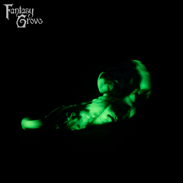 A fantasy sex toy on a black background with the Fantasy Grove logo in the upper left corner