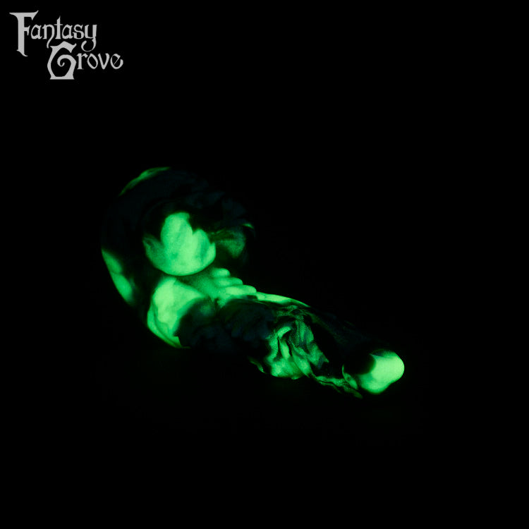 A fantasy sex toy on a black background with the Fantasy Grove logo in the upper left corner