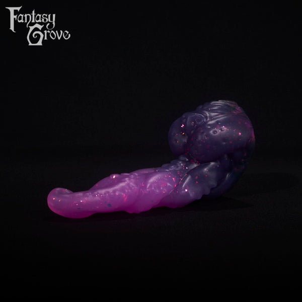 A fantasy sex toy on a black background with the Fantasy Grove logo in the upper left corner