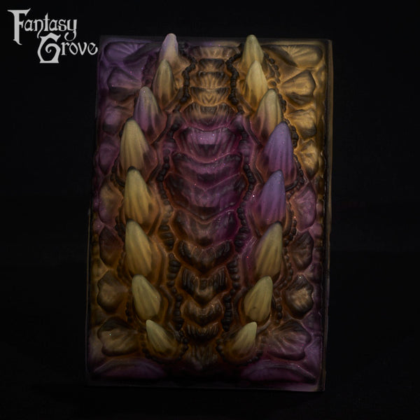 A fantasy sex toy on a black background with the Fantasy Grove logo in the upper left corner
