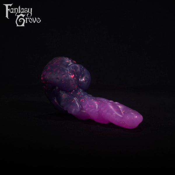 A fantasy sex toy on a black background with the Fantasy Grove logo in the upper left corner