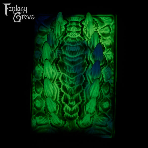 A fantasy sex toy on a black background with the Fantasy Grove logo in the upper left corner