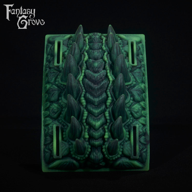 A fantasy sex toy on a black background with the Fantasy Grove logo in the upper left corner