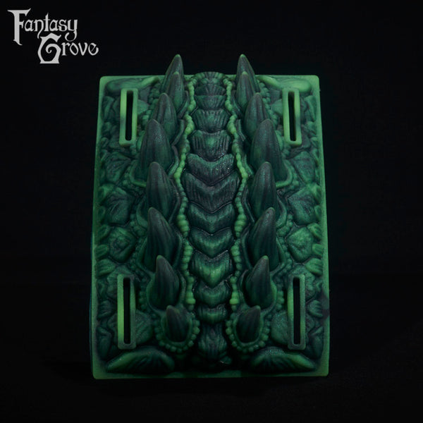 A fantasy sex toy on a black background with the Fantasy Grove logo in the upper left corner