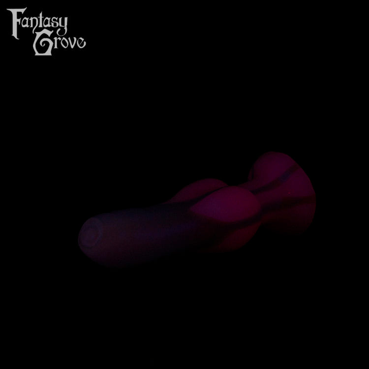 A Fantasy Grove sex toy on a black background with a logo in the upper left corner