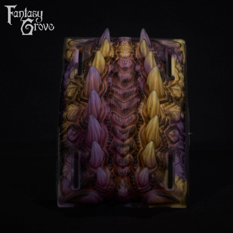 A fantasy sex toy on a black background with the Fantasy Grove logo in the upper left corner