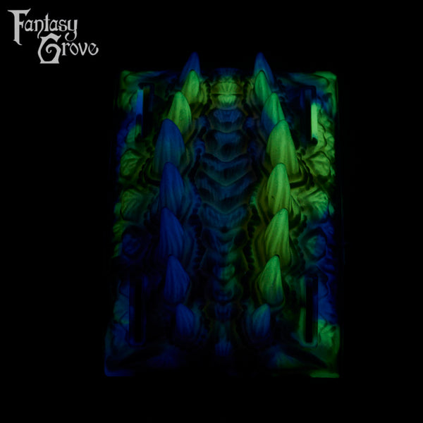 A fantasy sex toy on a black background with the Fantasy Grove logo in the upper left corner