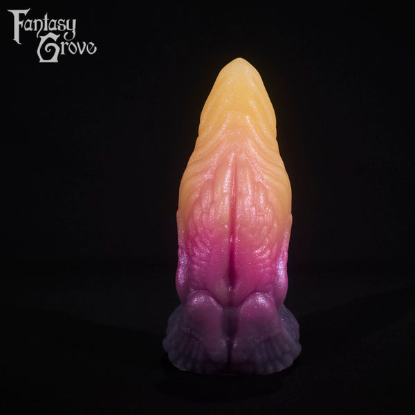 A fantasy sex toy on a black background with the Fantasy Grove logo in the upper left corner