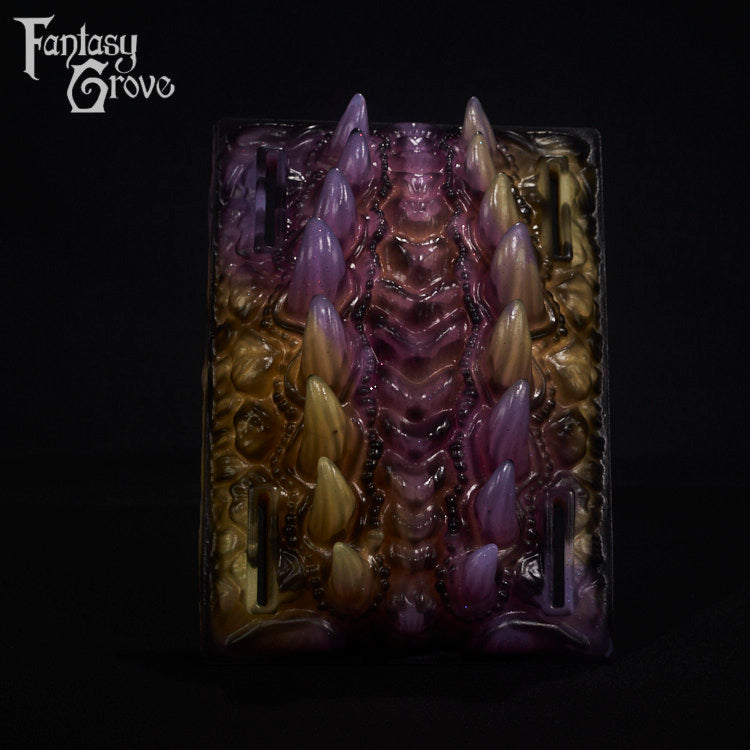 A fantasy sex toy on a black background with the Fantasy Grove logo in the upper left corner