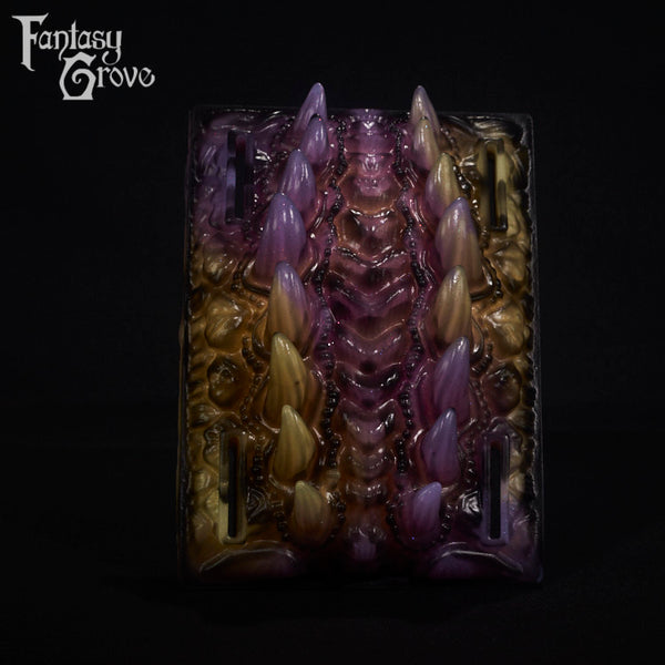 A fantasy sex toy on a black background with the Fantasy Grove logo in the upper left corner