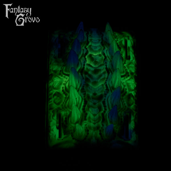 A fantasy sex toy on a black background with the Fantasy Grove logo in the upper left corner