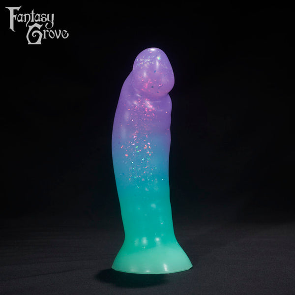 A Fantasy Grove sex toy on a black background with a logo in the upper left corner
