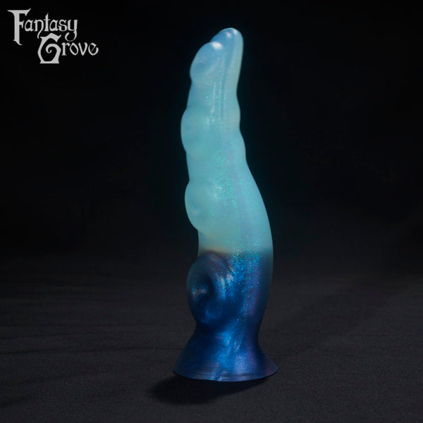 A Fantasy Grove sex toy on a black background with a logo in the upper left corner