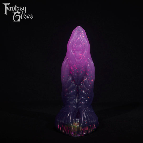 A fantasy sex toy on a black background with the Fantasy Grove logo in the upper left corner