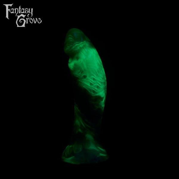 A fantasy sex toy on a black background with the Fantasy Grove logo in the upper left corner