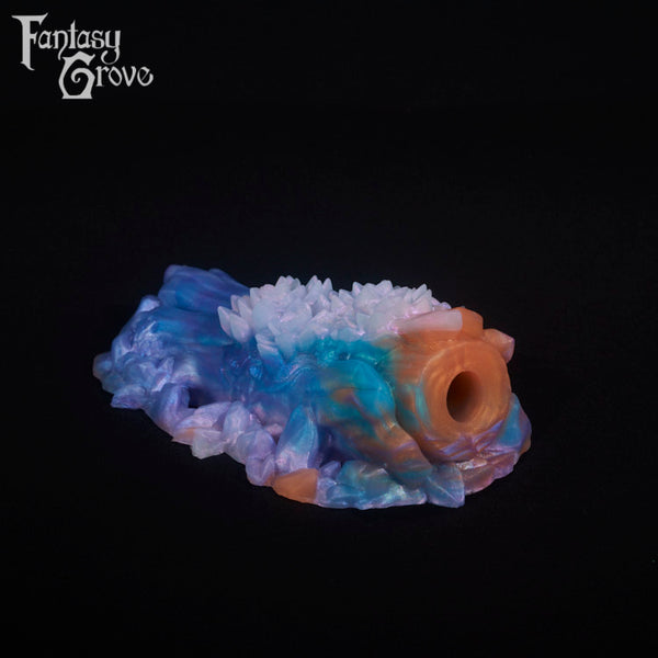 A fantasy sex toy on a black background with the Fantasy Grove logo in the upper left corner