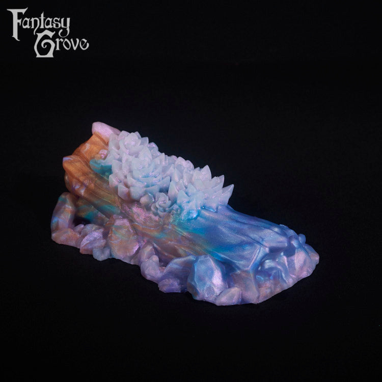 A fantasy sex toy on a black background with the Fantasy Grove logo in the upper left corner