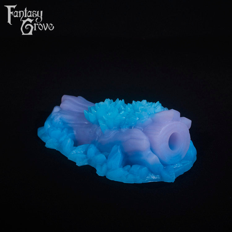 A fantasy sex toy on a black background with the Fantasy Grove logo in the upper left corner