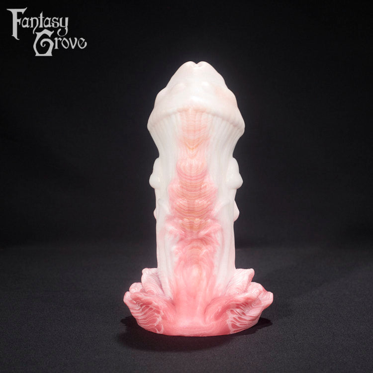A fantasy sex toy on a black background with the Fantasy Grove logo in the upper left corner 
