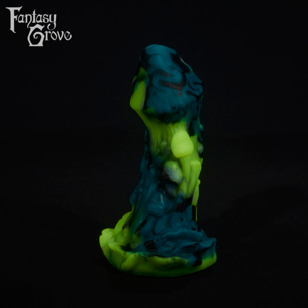 A fantasy sex toy on a black background with the Fantasy Grove logo in the upper left corner