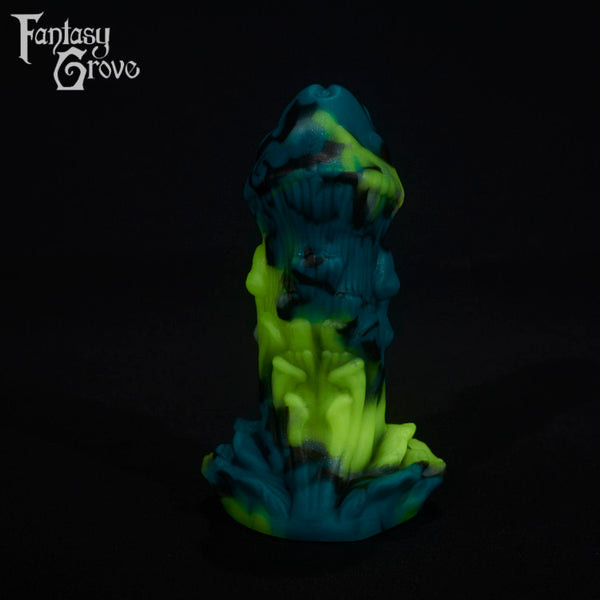 A fantasy sex toy on a black background with the Fantasy Grove logo in the upper left corner