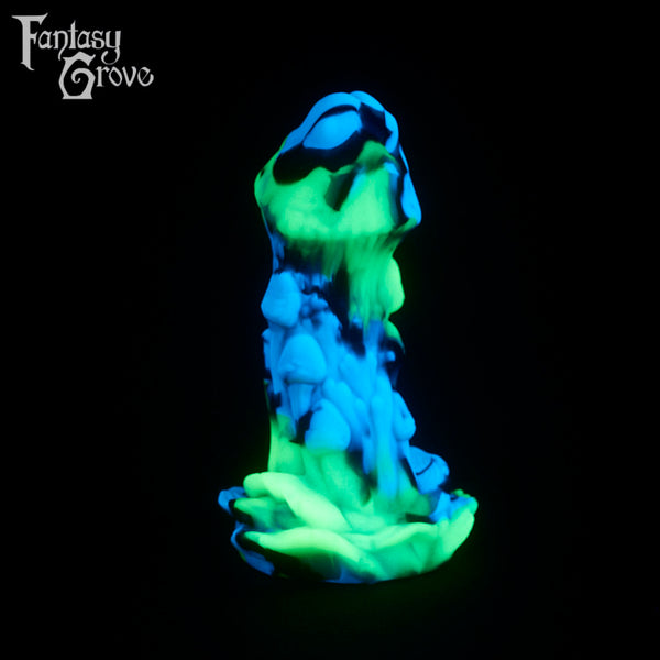 A fantasy sex toy on a black background with the Fantasy Grove logo in the upper left corner
