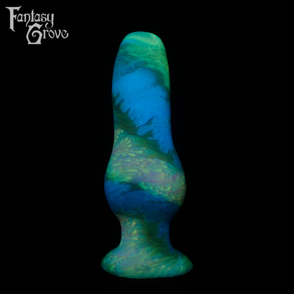 A fantasy sex toy on a black background with the Fantasy Grove logo in the upper left corner