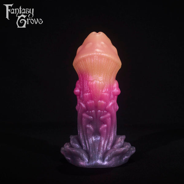 A fantasy sex toy on a black background with the Fantasy Grove logo in the upper left corner