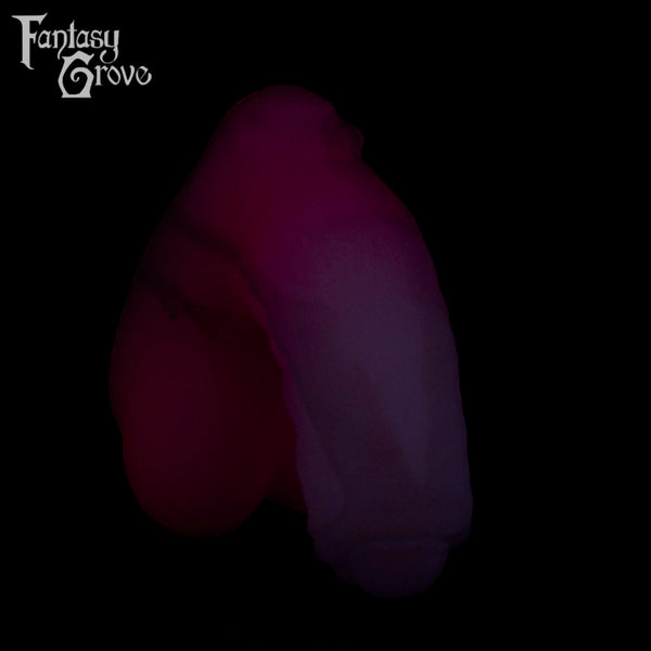 A Fantasy Grove sex toy on a black background with a logo in the upper left corner
