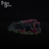 A fantasy sex toy on a black background with the Fantasy Grove logo in the upper left corner