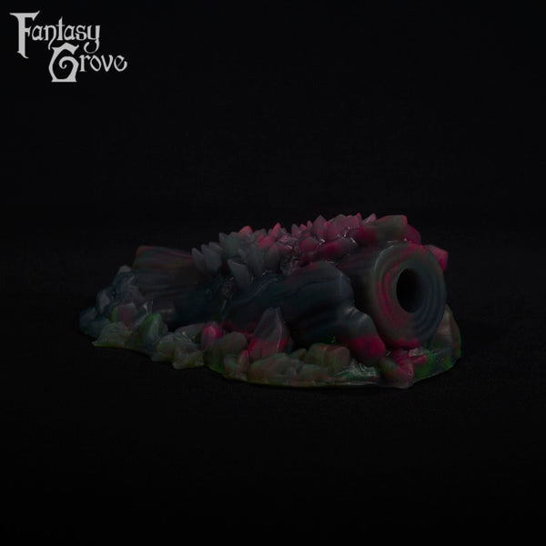 A fantasy sex toy on a black background with the Fantasy Grove logo in the upper left corner