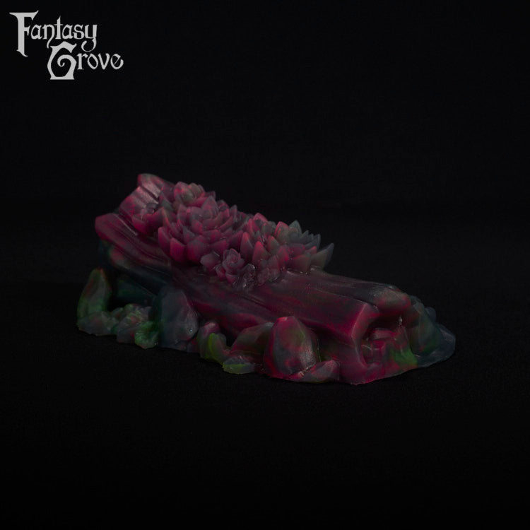 A fantasy sex toy on a black background with the Fantasy Grove logo in the upper left corner
