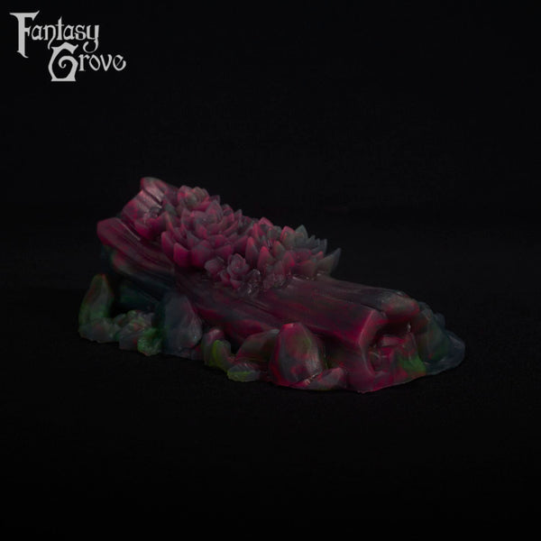 A fantasy sex toy on a black background with the Fantasy Grove logo in the upper left corner