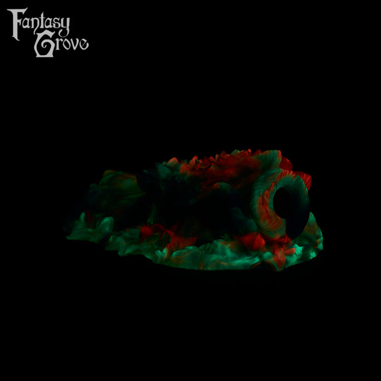 A fantasy sex toy on a black background with the Fantasy Grove logo in the upper left corner