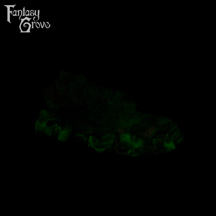 A fantasy sex toy on a black background with the Fantasy Grove logo in the upper left corner